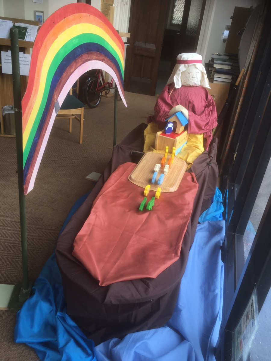 Church window display showing Messy Church banner